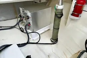 Engine room of 2021 Leopard 50 yacht with equipment and fire extinguisher.