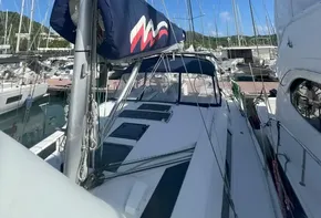 2020 Beneteau Oceanis 46.1 sailboat docked in marina under clear blue sky.