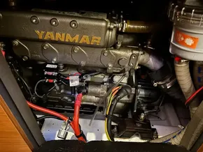 Yanmar engine in a 2019 Jeanneau Sun Odyssey 440 sailboat, showcasing detailed components.