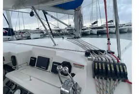 2020 Leopard 40 catamaran cockpit with navigation equipment and rigging, docked at marina.