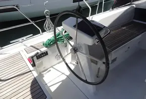 Steering wheel and cockpit of a 2020 Beneteau Oceanis 46.1 sailboat.