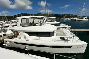 2025 Robertson and Caine Leopard 46 Powercat docked at marina under clear skies.