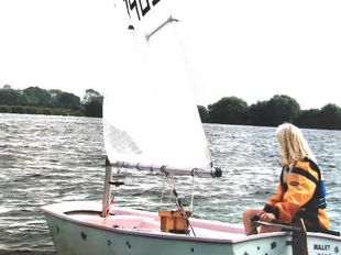 Optimist sailing dinghy