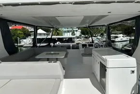 Interior view of 2022 Leopard 53 Powercat yacht with modern seating and helm station.