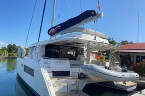 2022 Leopard 45 yacht docked, featuring a sleek design and spacious deck area.