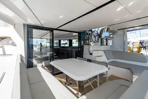 Luxurious interior of 2025 Leopard 46 yacht with modern seating and dining area.