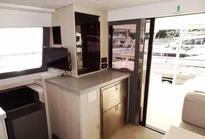 Interior of 2017 Leopard 43 Powercat yacht with modern cabinetry and marina view.