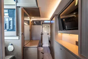 Modern interior of 2025 Leopard 46 yacht, featuring sleek wood finishes and integrated technology.