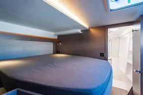 Luxurious cabin interior of 2025 Leopard 46 yacht with modern lighting and ensuite bathroom.