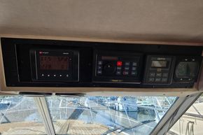 Control panel of a 1989 Princess 35 Flybridge yacht with navigation instruments.