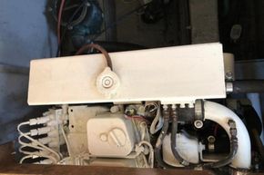 Engine compartment of a 1989 Princess 35 Flybridge boat, showcasing mechanical components.