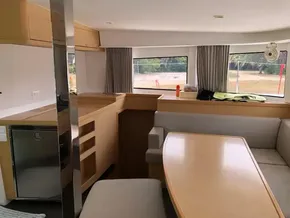 Interior of 2020 Lagoon 42 catamaran with modern kitchen and dining area.