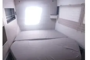 Interior cabin of 2018 Leopard 45 catamaran with bed and storage drawers.