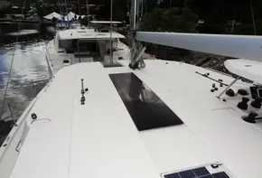 Leopard 45 catamaran 2017 model docked, showcasing spacious deck and solar panels.