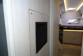 Interior of 2017 Leopard 45 yacht cabin with modern design and cozy bed.