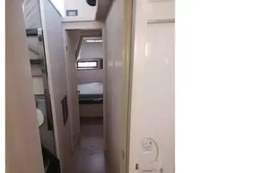 Interior of 2018 Leopard 45 yacht showing hallway and bathroom.