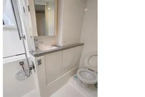 Modern bathroom in 2020 Leopard 45 yacht with shower and toilet.