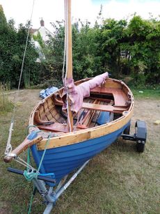 Delightful wooden clinker gaff-rigged dinghy