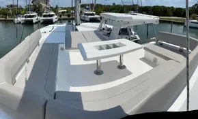 Leopard 50 yacht 2020 model with spacious deck and seating area in marina.