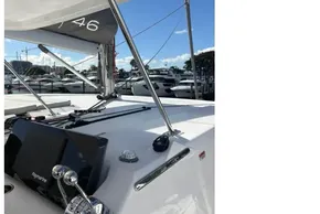 Modern Leopard 46 yacht cockpit with navigation controls, docked in a marina, 2025 model.