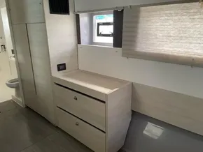 Modern interior of a 2020 Leopard 50 yacht with sleek cabinetry and window blinds.