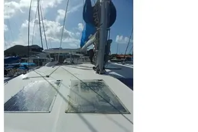 2022 Leopard 45 catamaran deck with solar panels under clear blue sky.