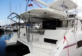 2017 Leopard 45 catamaran docked at marina, rear view.