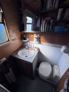 Bathroom sink, cupboards and cassette toilet