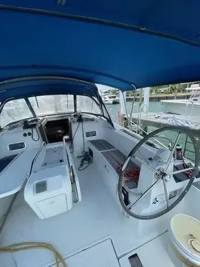2017 Jeanneau Sun Odyssey 519 sailboat cockpit with blue canopy.