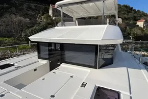 2024 Leopard 40 Powercat yacht with sleek design and spacious deck, docked in a scenic location.