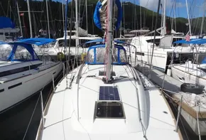 2017 Jeanneau Sun Odyssey 389 sailboat docked in a marina.