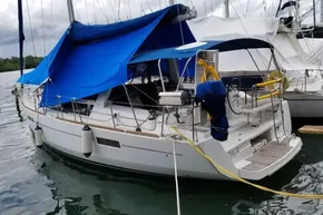 2013 Beneteau Oceanis 41 sailboat docked with blue canopy cover.
