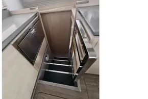 Staircase in 2019 Leopard 50 yacht interior with modern design and stainless steel accents.