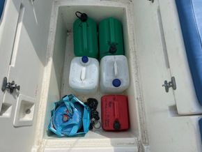 Under cockpit well for liferaft currently used for storage
