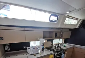 Modern kitchen in 2020 Beneteau Oceanis 46.1 yacht with sleek cabinetry and appliances.