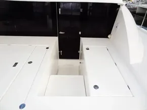 2018 Leopard 43 Powercat deck with storage compartments and access door.