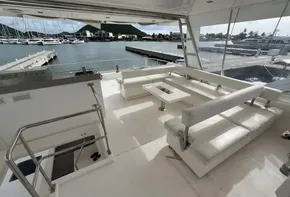 Spacious deck of 2019 Leopard 51 Powercat yacht with marina view.