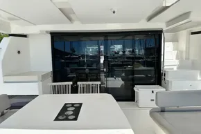Leopard 53 Powercat 2022 yacht interior with modern seating and glass doors.
