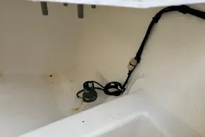 Bilge area of 2024 Leopard 40 Powercat with wiring and pump visible.