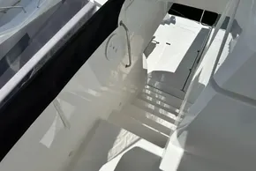 Staircase on 2025 Robertson and Caine Leopard 46 Powercat, showcasing sleek design and modern finish.