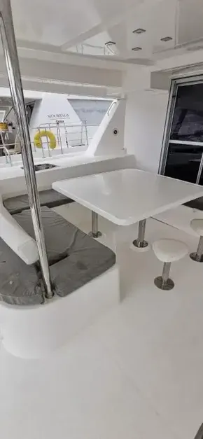 2019 Leopard 51 Powercat yacht with outdoor seating and dining area.
