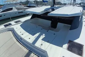 2018 Leopard 45 catamaran deck view with open hatches in marina setting.