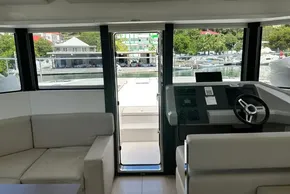 Interior view of 2022 Leopard 53 Powercat yacht, featuring helm and seating area.