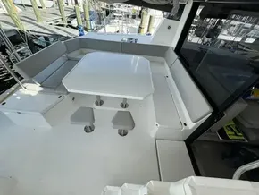 Spacious seating area on a 2020 Leopard 50 catamaran, featuring a modern white table.