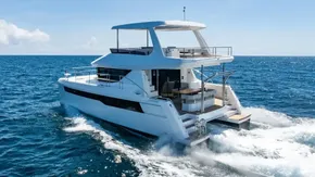 2025 Leopard 40 Powercat cruising on open sea under clear blue sky.