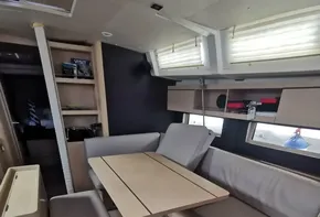 Interior of 2020 Beneteau Oceanis 46.1 yacht with modern seating and dining area.