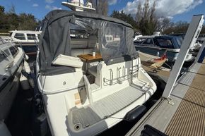 1991 Sealine 290 Ambassador yacht docked at marina, rear view with canopy.