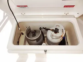 Propane storage compartment on a 2021 Leopard 40 boat, featuring two gas cylinders.