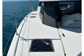 2022 Leopard 42 yacht deck with clear ocean view and blue sky.