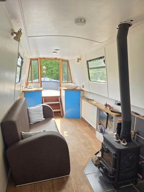 Front room showing bespoke sofa and Morso Squirrel stove